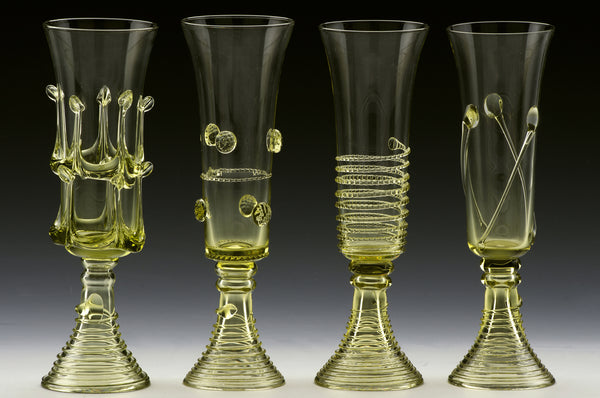 Lodge Flute - Light green glass drinkware for a glass of wine at your home or champagne toast at your wedding. Beautiful designs by northwestern and central Europe artists inspired by medieval times, when “forest glass” glassmaking technologies were developed.